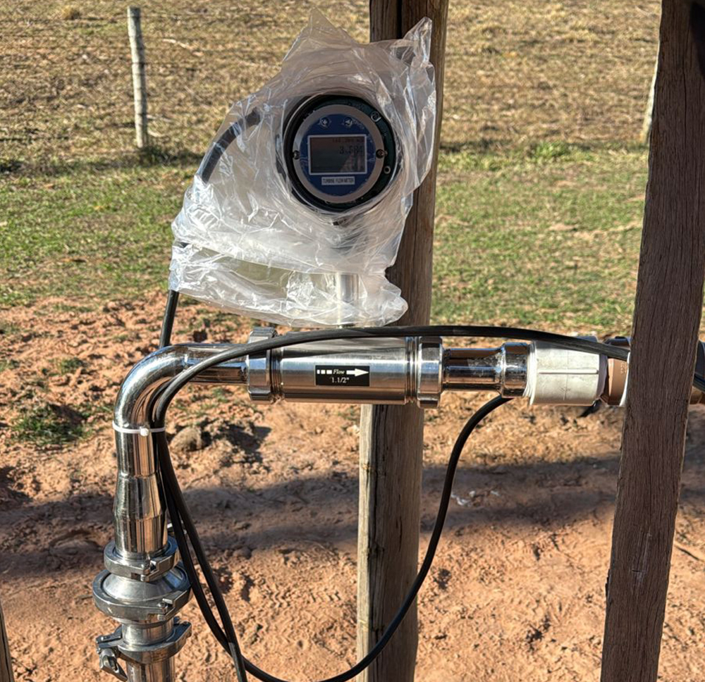 Calibration setup showing flow meter connected to test rig with water flow used to determine K-factor accuracy.