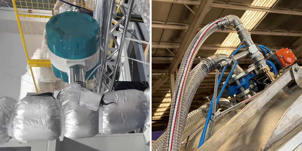 Technicians performing turbine flow meter calibration and installation checks in an industrial setting.